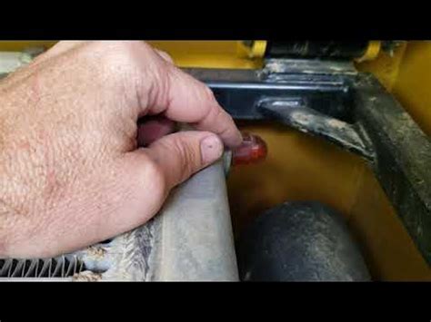 skid steer radiator flush|caterpillar skid steer coolant drain.